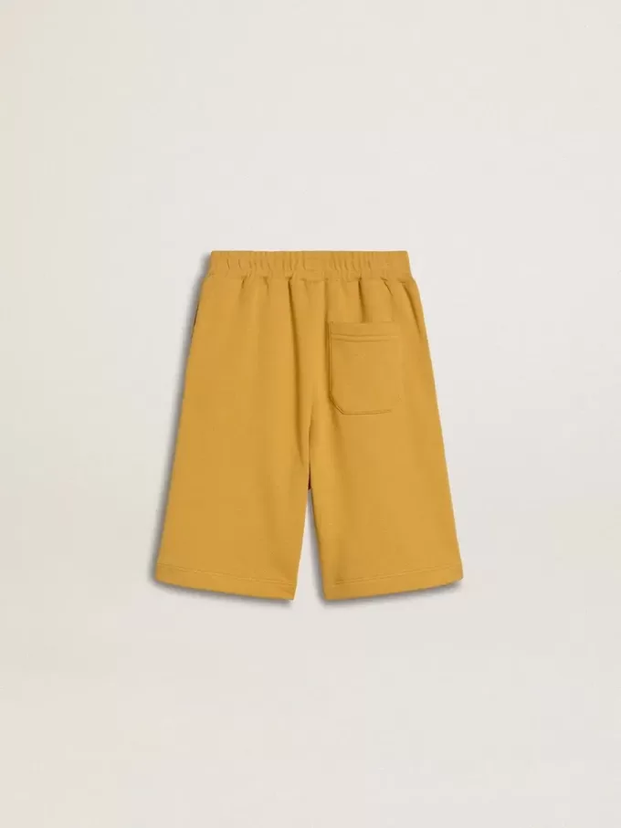Kinderjoggingbroek in okergeel met borduursel