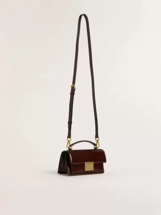 Kleine Venezia-tas van donkerbruin gelamineerd leer met gouden details