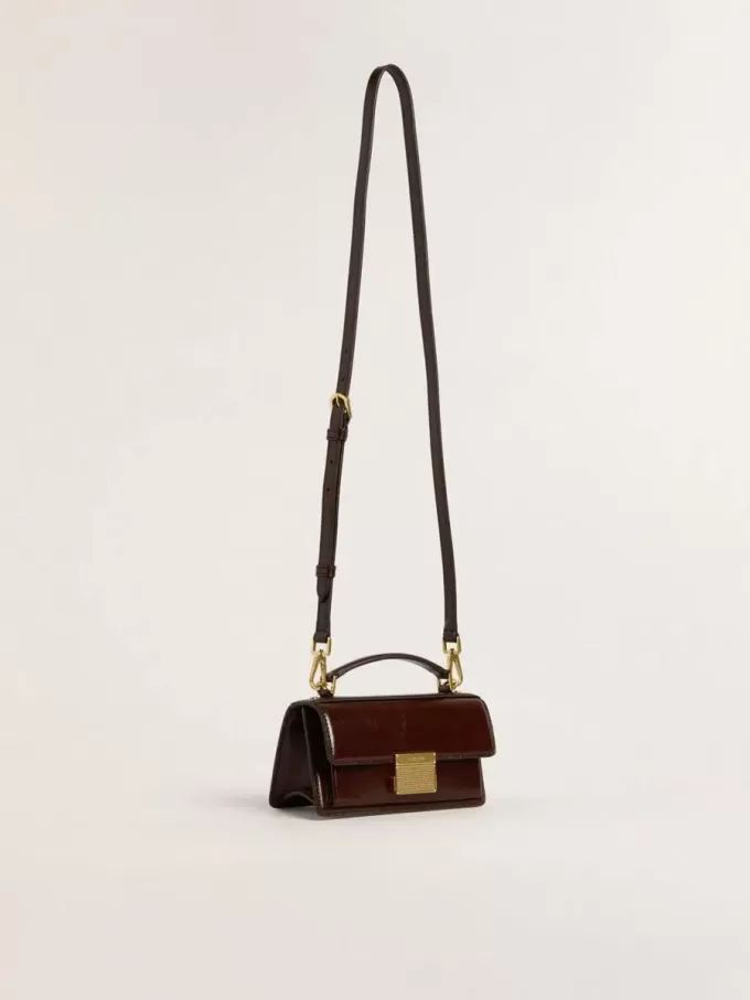 Kleine Venezia-tas van donkerbruin gelamineerd leer met gouden details