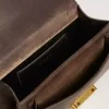 Kleine Venezia-tas van donkerbruin leer met gouden gesp