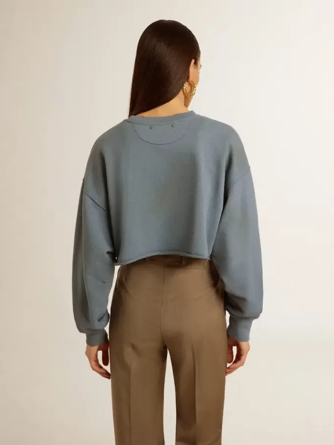 Kort sweatshirt in babyblauw met distressed afwerking