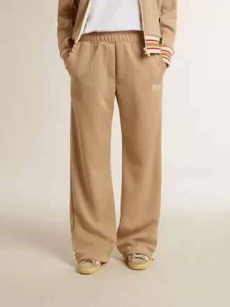 Lichtbeige joggingbroek voor dames met wit logo