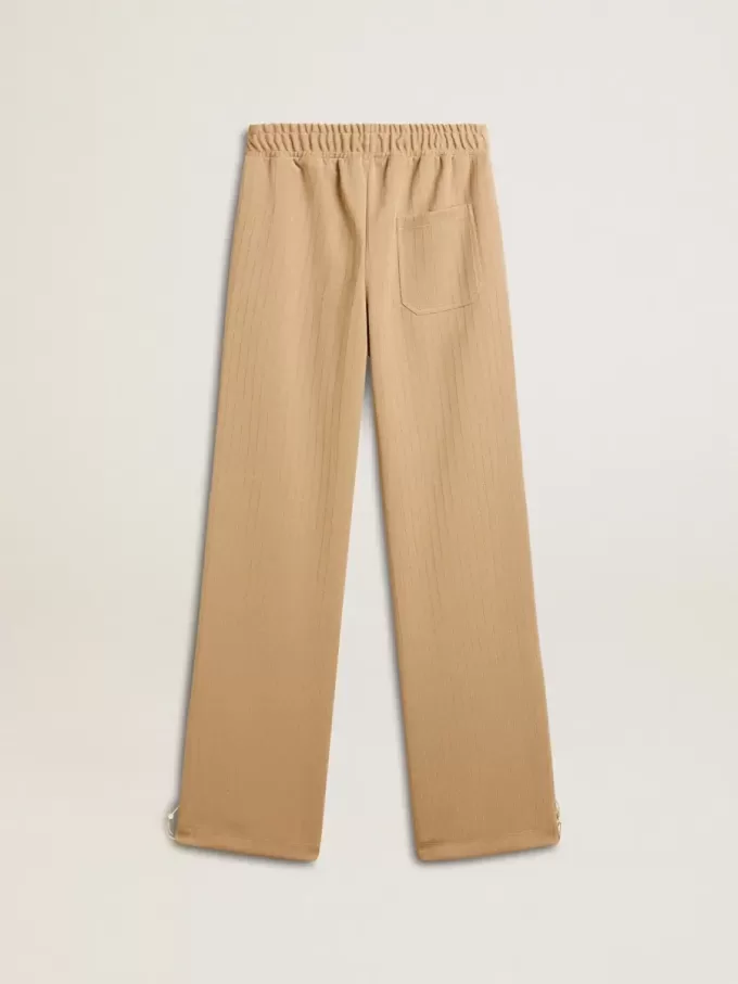 Lichtbeige joggingbroek voor dames met wit logo