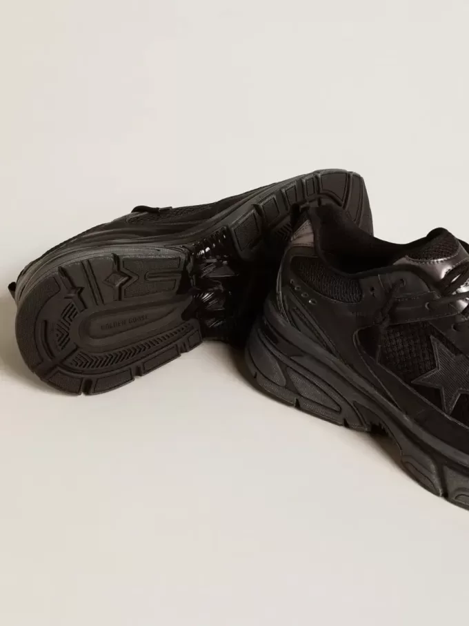 Lightstar voor dames met zwart leer en mesh bovenwerk en zwarte ster