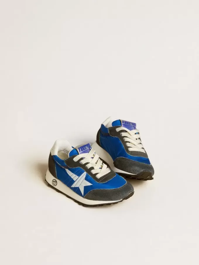 Marathon Junior in blauw nylon met bedrukte ster en leren hielstuk