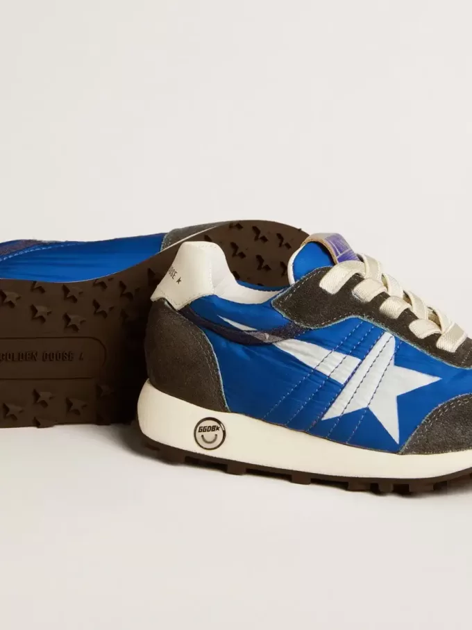 Marathon Junior in blauw nylon met bedrukte ster en leren hielstuk