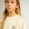 Meisjes-T-shirt in versleten wit met borduursel op de voorkant en print op de achterkant