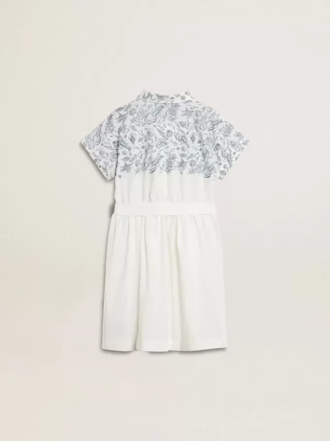 Meisjesshirtjurk van wit katoenen canvas met een blauwe nautische print en witte biezen.