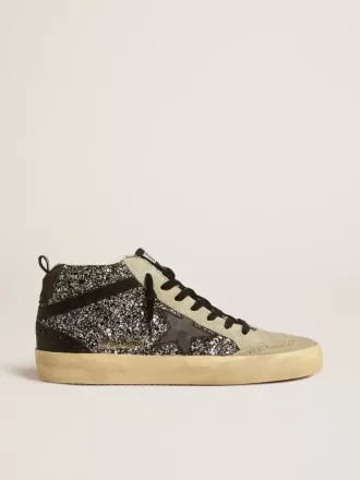 Mid Star LTD in zwart glitter met zwarte leren ster en flash