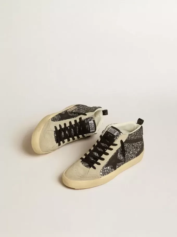 Mid Star LTD in zwart glitter met zwarte leren ster en flash