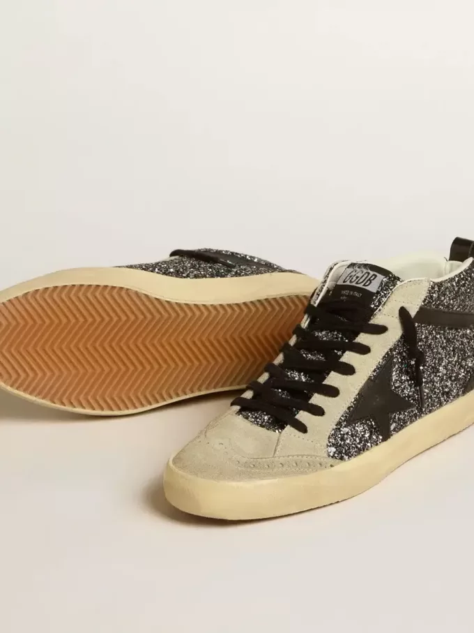 Mid Star LTD in zwart glitter met zwarte leren ster en flash