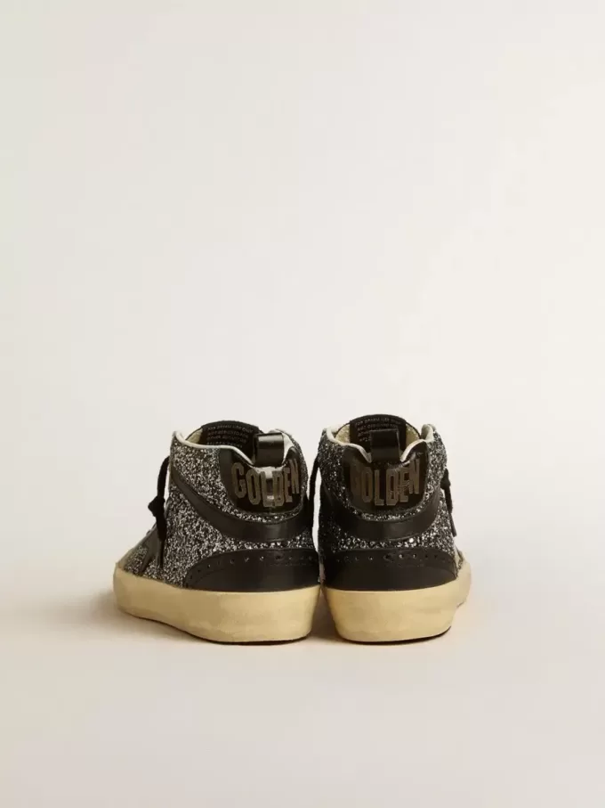 Mid Star LTD in zwart glitter met zwarte leren ster en flash