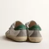 Old School Young met metallic leren ster en groene hiellip