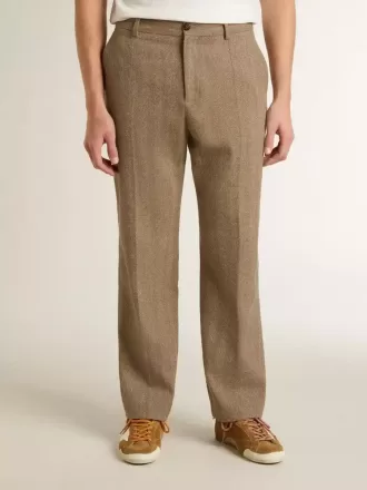 Op maat gemaakte broek in zandkleurig linnen met chevronpatroon