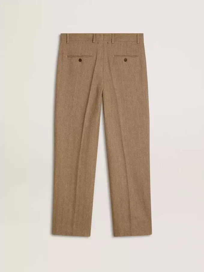 Op maat gemaakte broek in zandkleurig linnen met chevronpatroon