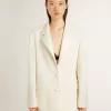 Oversized jasje met enkele knoopsluiting in wit met zijde-effect en borduursels.