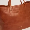 Pasadena-tas in glanzend, gehamerd leer in tan-kleur met gouden logo op de voorkant
