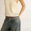 Pergamentkleurige mouwloze top