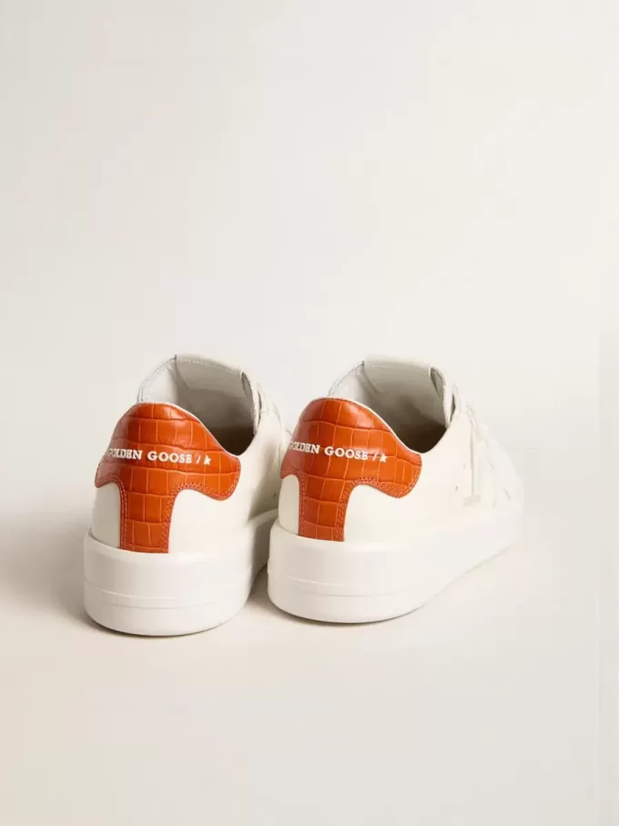 Purestar voor dames met witte leren ster en oranje hielstuk