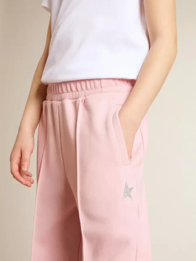 Roze joggingbroek met glitterster op de voorkant