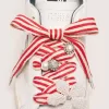 Skin “Playful” rode en beige gestreepte veters met applicatiebedeltjes