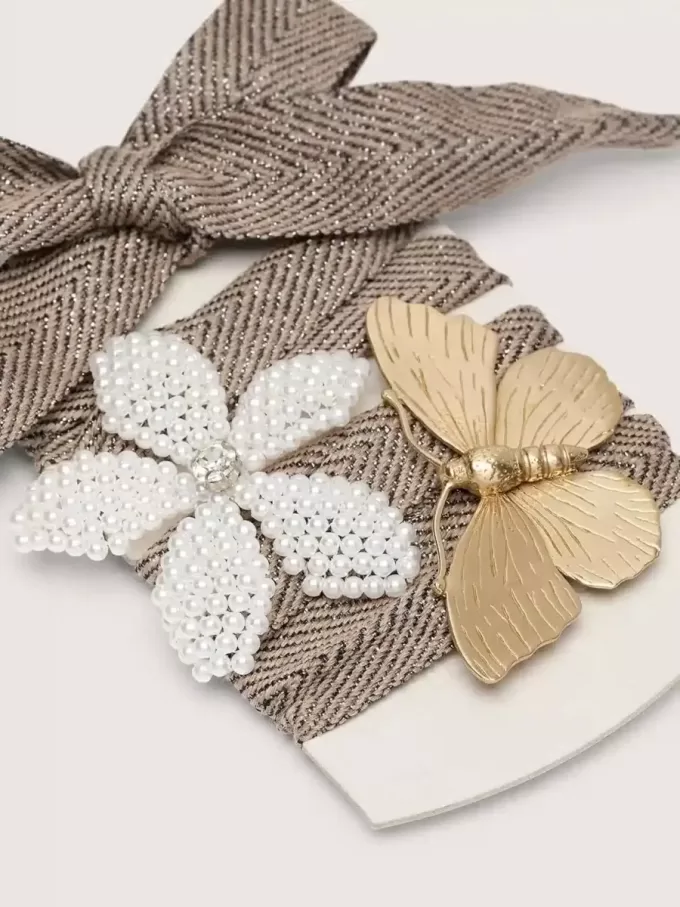 Skin “Sparkling” bruine, zwarte en zilveren visgraatveters met twee applicatiebedeltjes