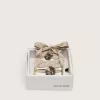 Skin “Vintage” beige geborduurde veters met applicatiebedeltjes