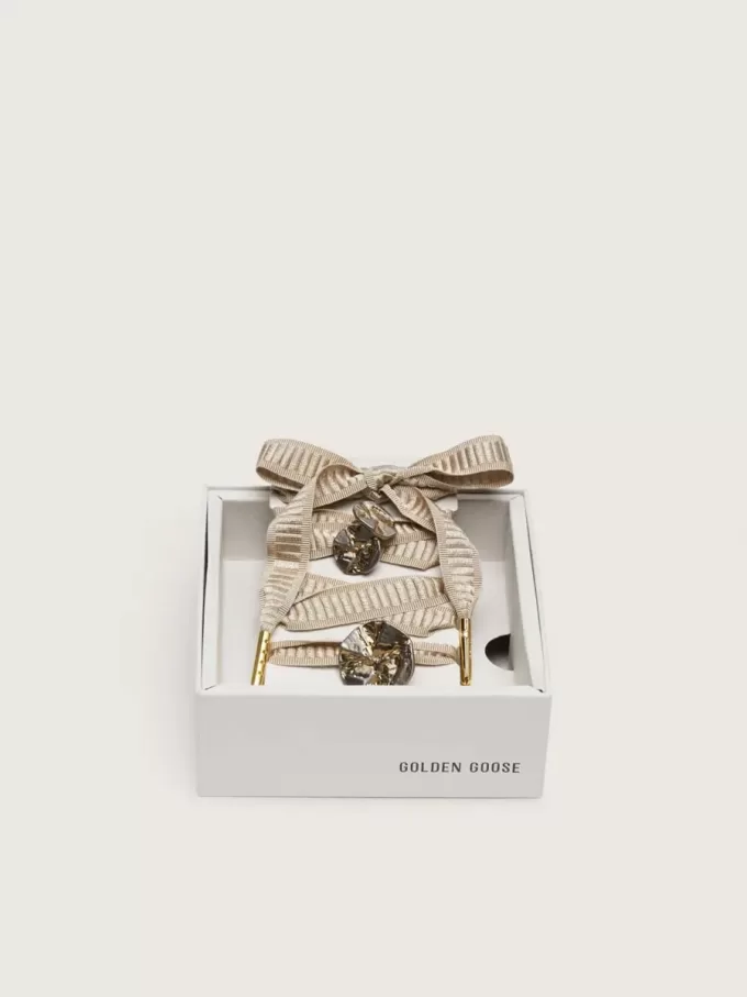 Skin “Vintage” beige geborduurde veters met applicatiebedeltjes