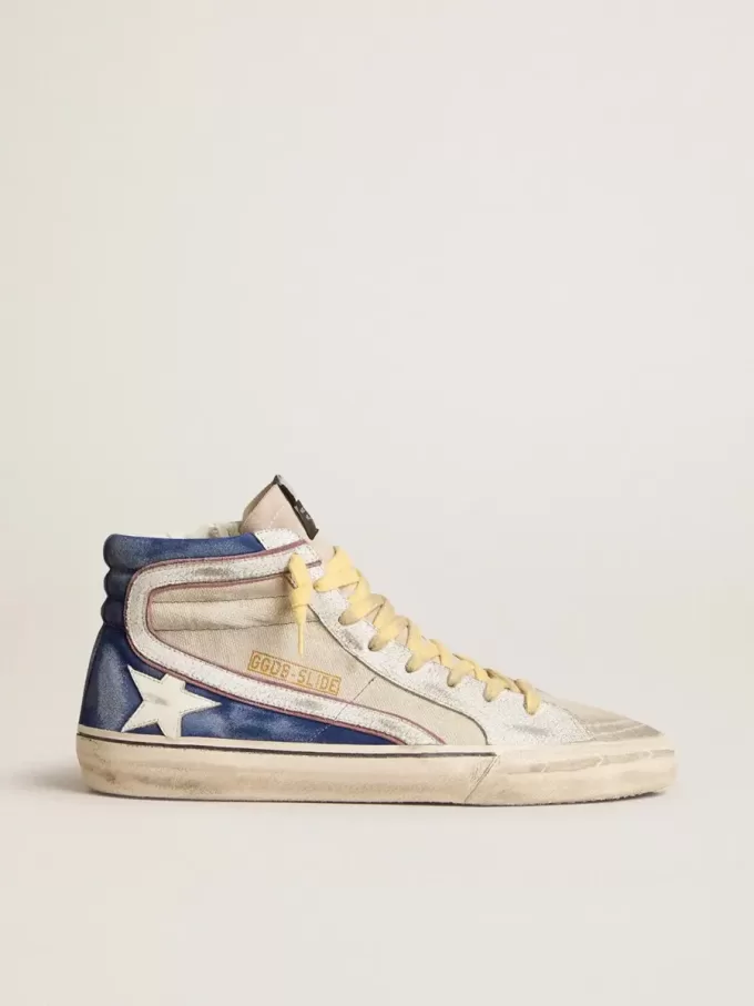 Slide van parelmoer canvas en blauw suède met witte leren ster en flash