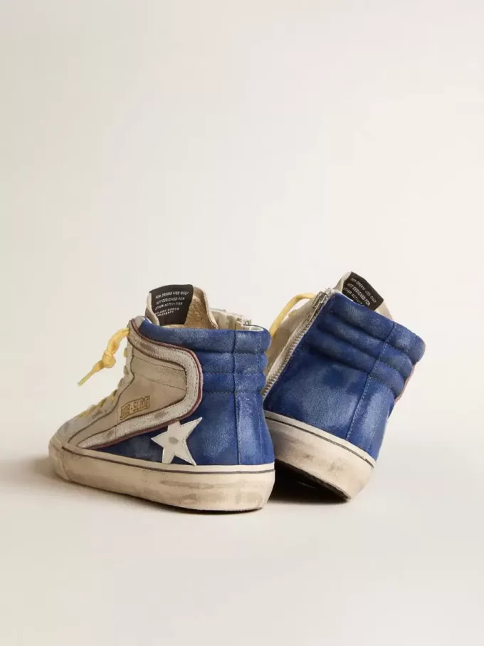 Slide van parelmoer canvas en blauw suède met witte leren ster en flash