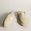 Space-Star-sabots voor dames in beige schapenvacht met witte leren ster