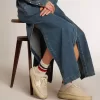 Space-Star-sabots voor dames in beige schapenvacht met witte leren ster