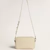 Star Bag in boterkleurig gehamerd leer met Swarovski-kristallen ster