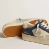 Stardan voor heren in grijs en blauw leer met crèmekleurige ster en hielstuk