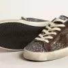 Super-Star in glitter met een bruine ster en lila hielbandje