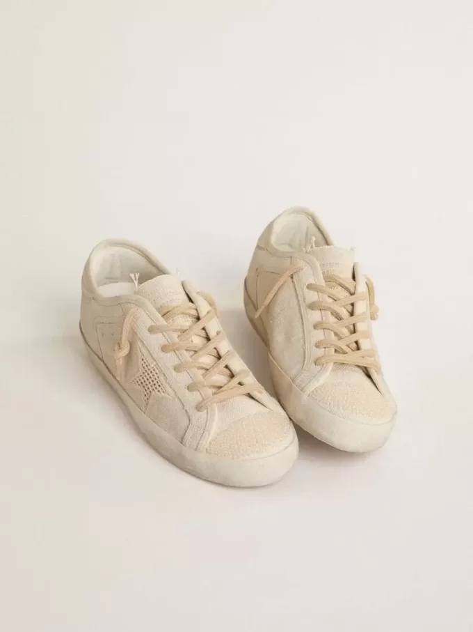 Super-Star in parelkleurig canvas met een ton-sur-ton mesh-effect ster