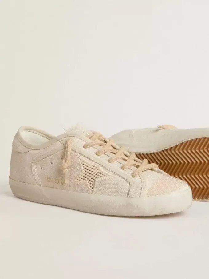 Super-Star in parelkleurig canvas met een ton-sur-ton mesh-effect ster