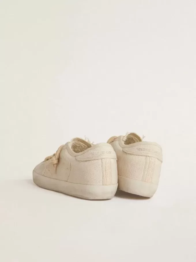 Super-Star in parelkleurig canvas met een ton-sur-ton mesh-effect ster