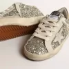 Super-Star Junior in glitter met een suède ster en gouden hiellip.