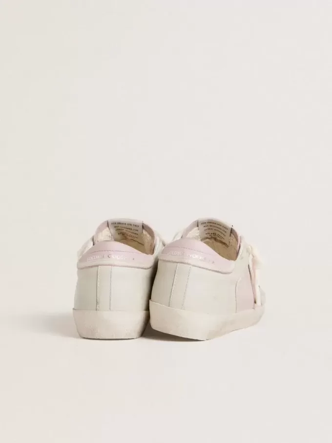 Super-Star LTD in roze leer met zilverkleurige leren ster en roze leren hielbandje.