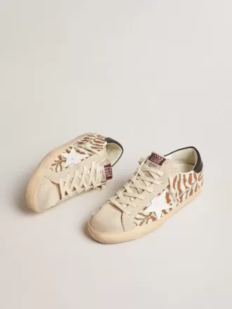 Super-Star LTD in zebra-effect Swarovski met een witte leren ster