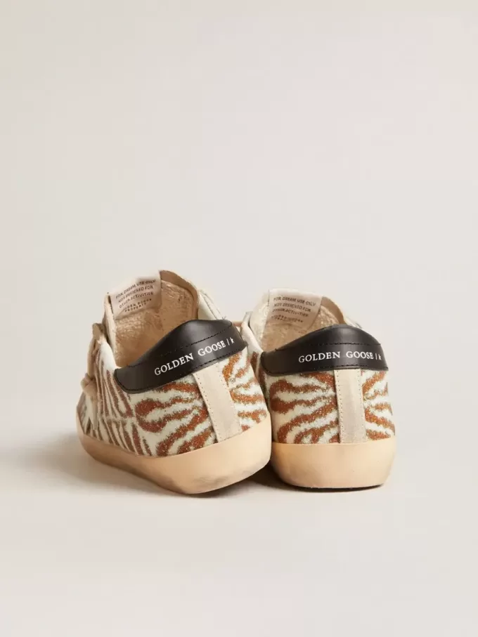 Super-Star LTD in zebra-effect Swarovski met een witte leren ster