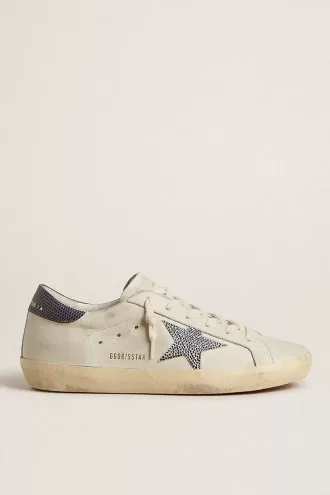 Super-Star LTD met crèmekleurige leren ster met Swarovski-kristallen en blauwe leren hielband met hagedisprint.