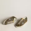 Super-Star LTD voor heren van suède met metallic leren ster en leren hielstuk.