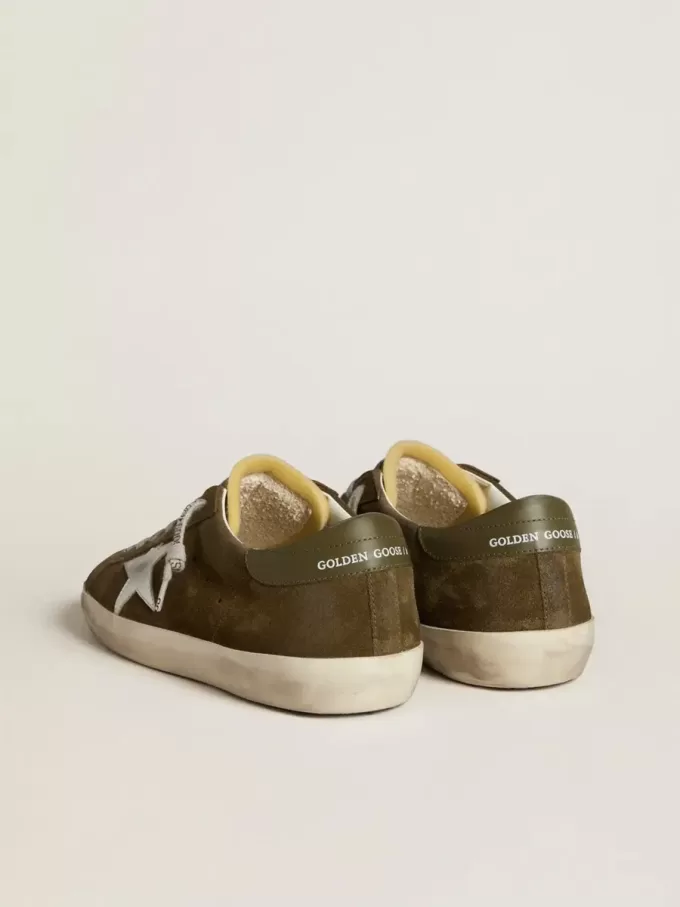 Super-Star LTD voor heren van suède met metallic leren ster en leren hielstuk.