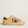 Super-Star voor dames in beige ponyhuid met bruine suède ster en hielstuk.