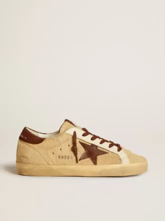 Super-Star voor dames in beige ponyhuid met bruine suède ster en hielstuk.