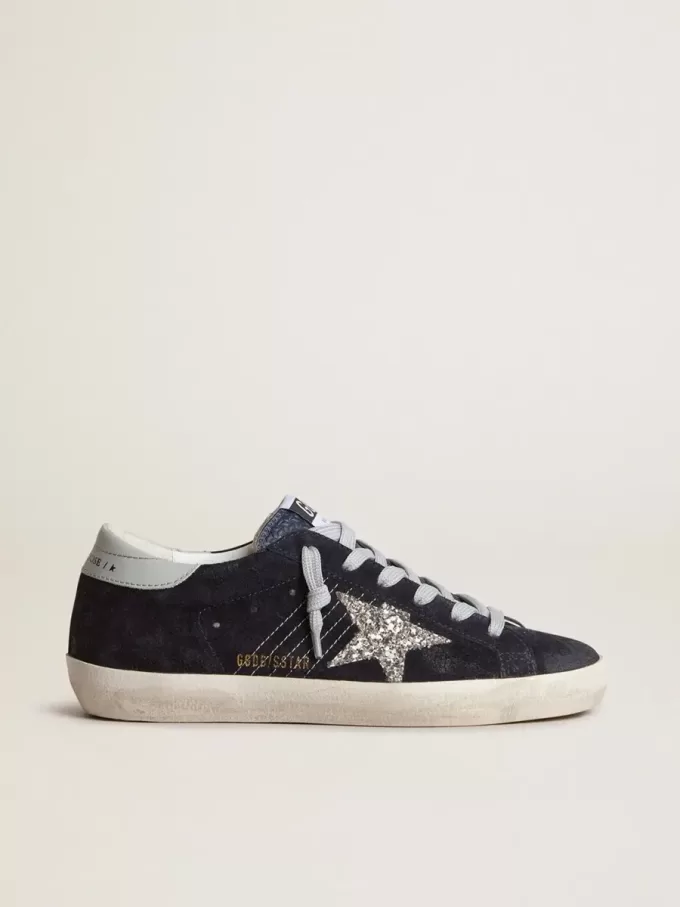Super-Star voor dames in blauw suède, met zilveren glitterster en leren hielstuk