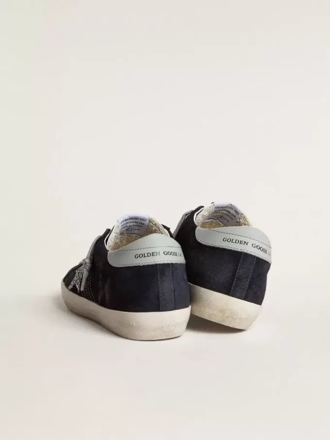 Super-Star voor dames in blauw suède, met zilveren glitterster en leren hielstuk