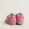 Super-Star voor dames in fuchsia suède met fluorescerende oranje gelamineerde leren ster en hielstuk.